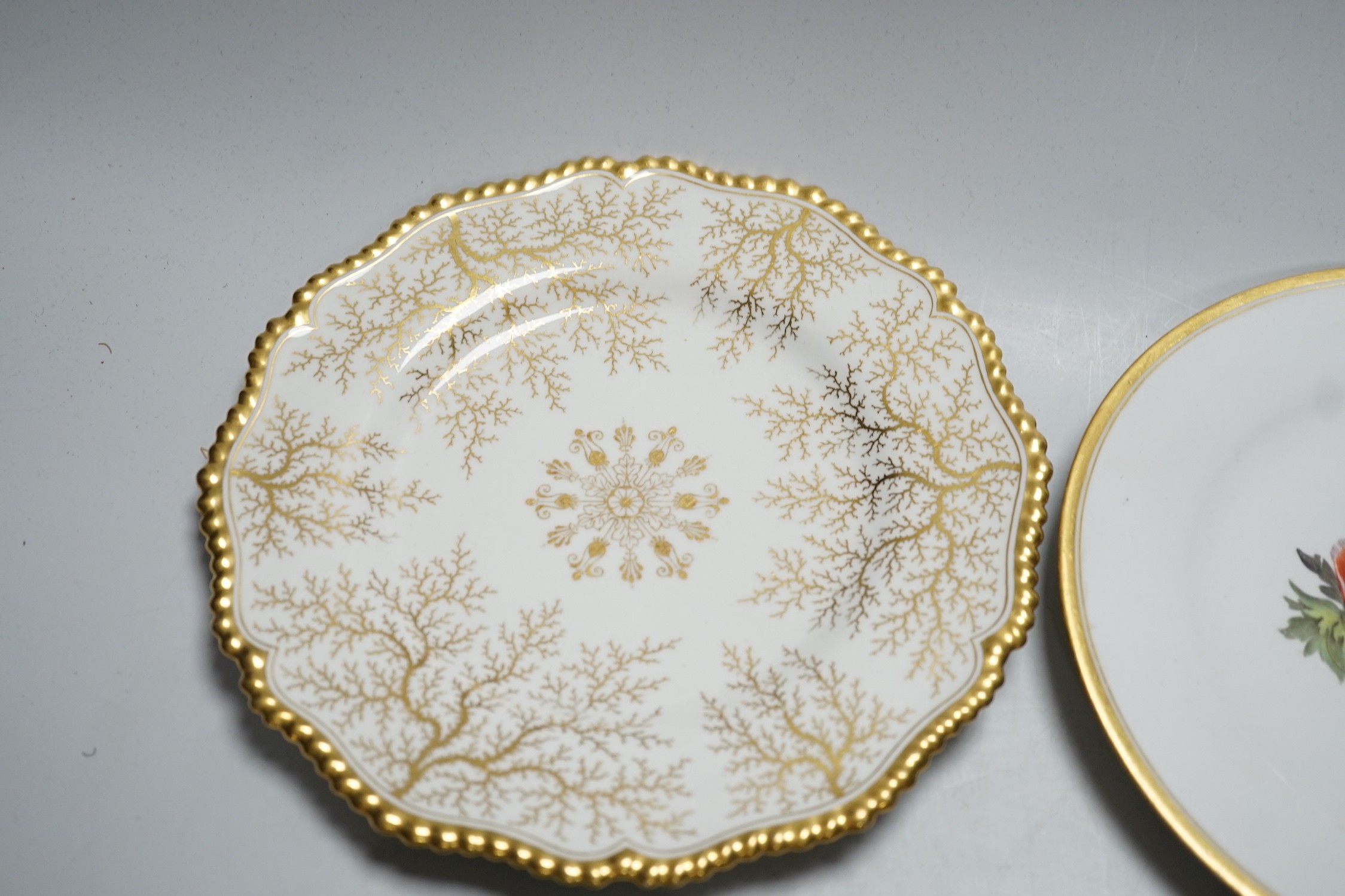 A Chamberlain's Worcester floral plate, and three Barr Flight & Barr plates, largest 22.5 cm